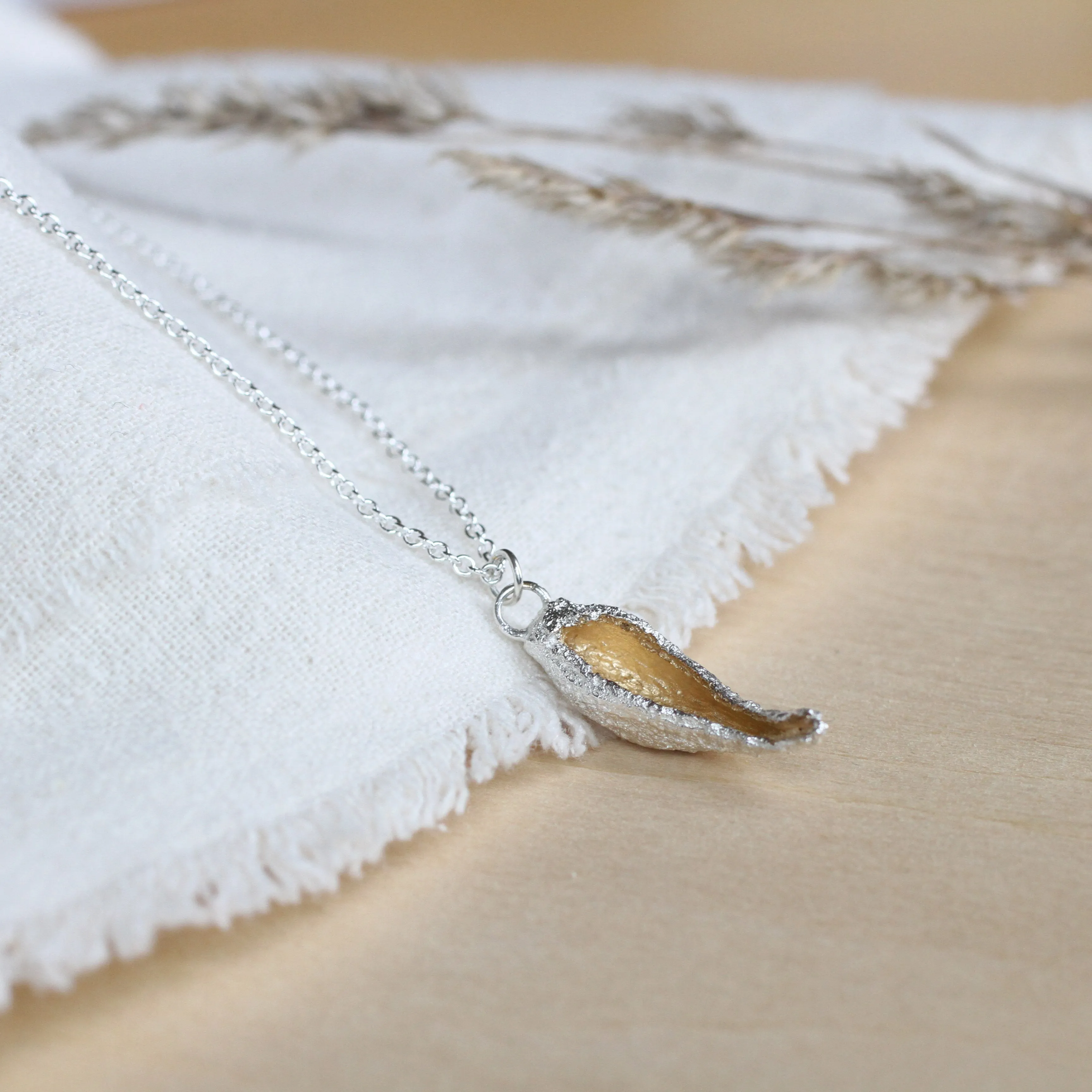hollow milkweed seed pod necklace